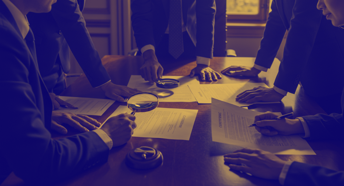 People reviewing contracts for information